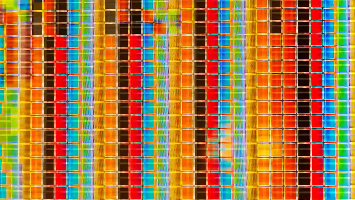 Rectangular image of dozens and dozens multi-colored blue, green, red, black, and orange squares